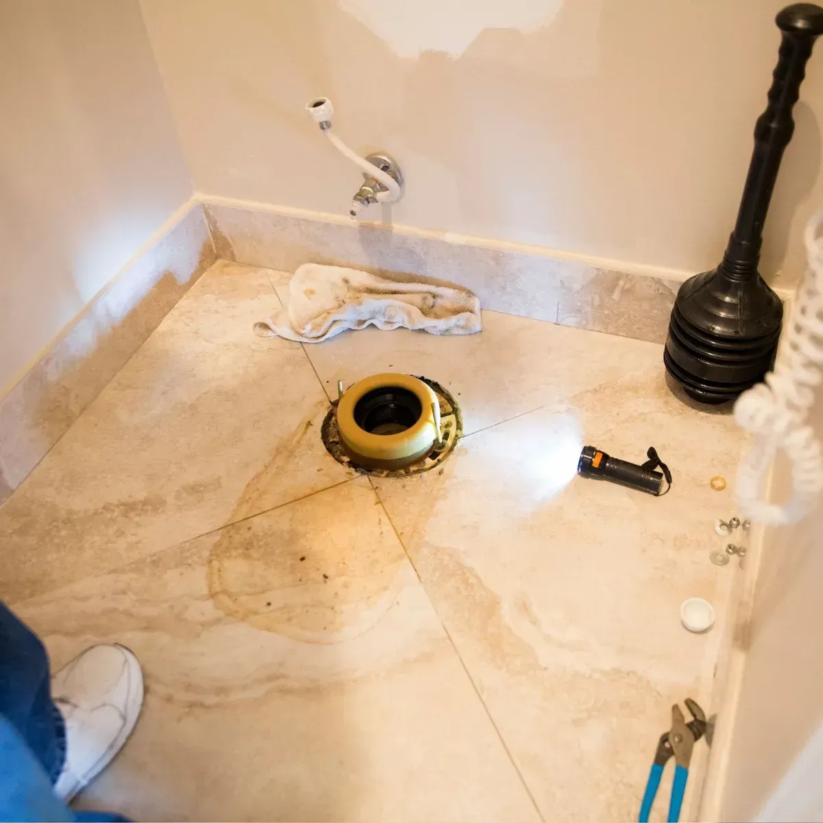 Commerce City plumber removing an outdated toilet.
