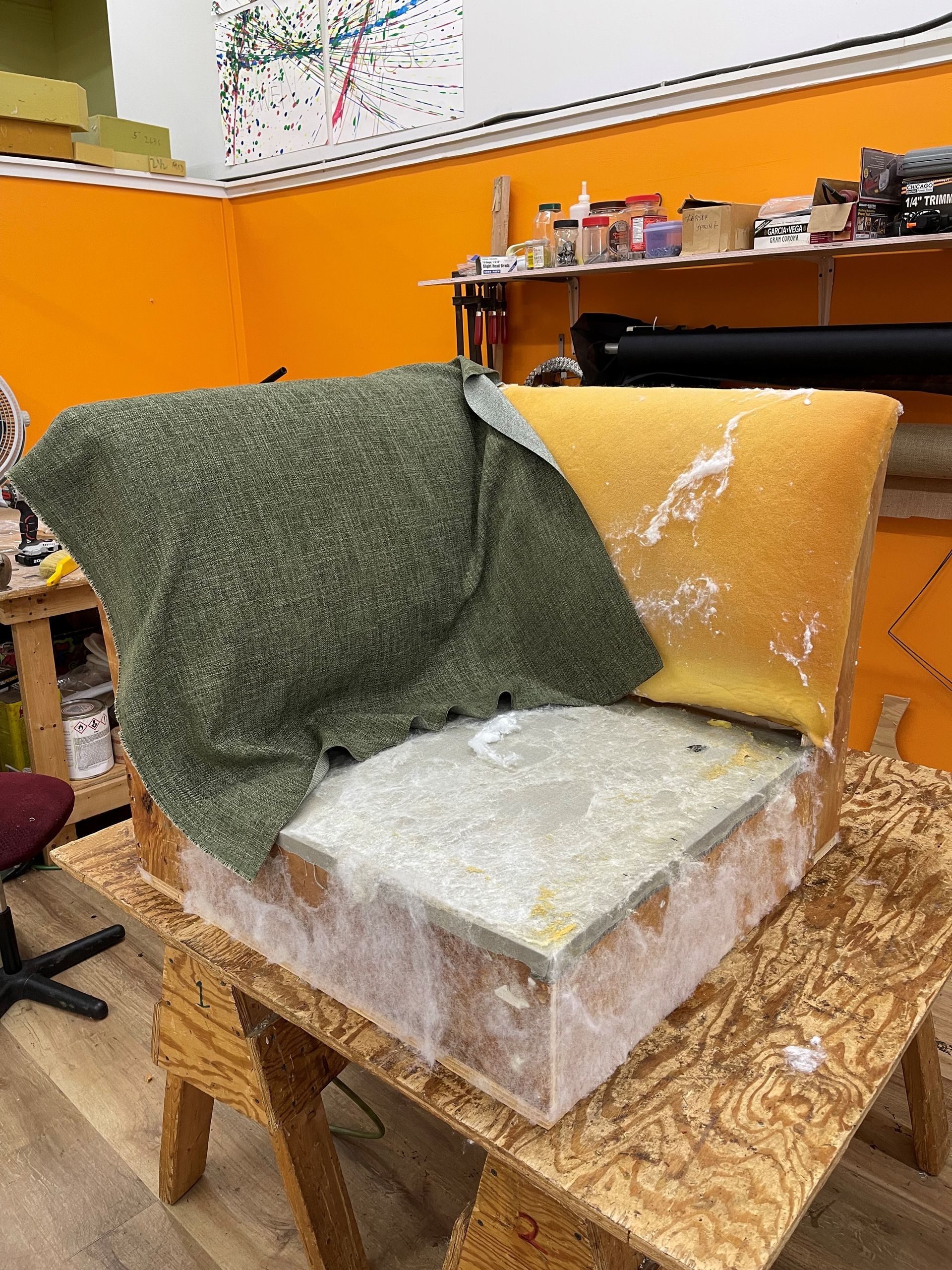 A piece of foam is sitting on top of a wooden table.