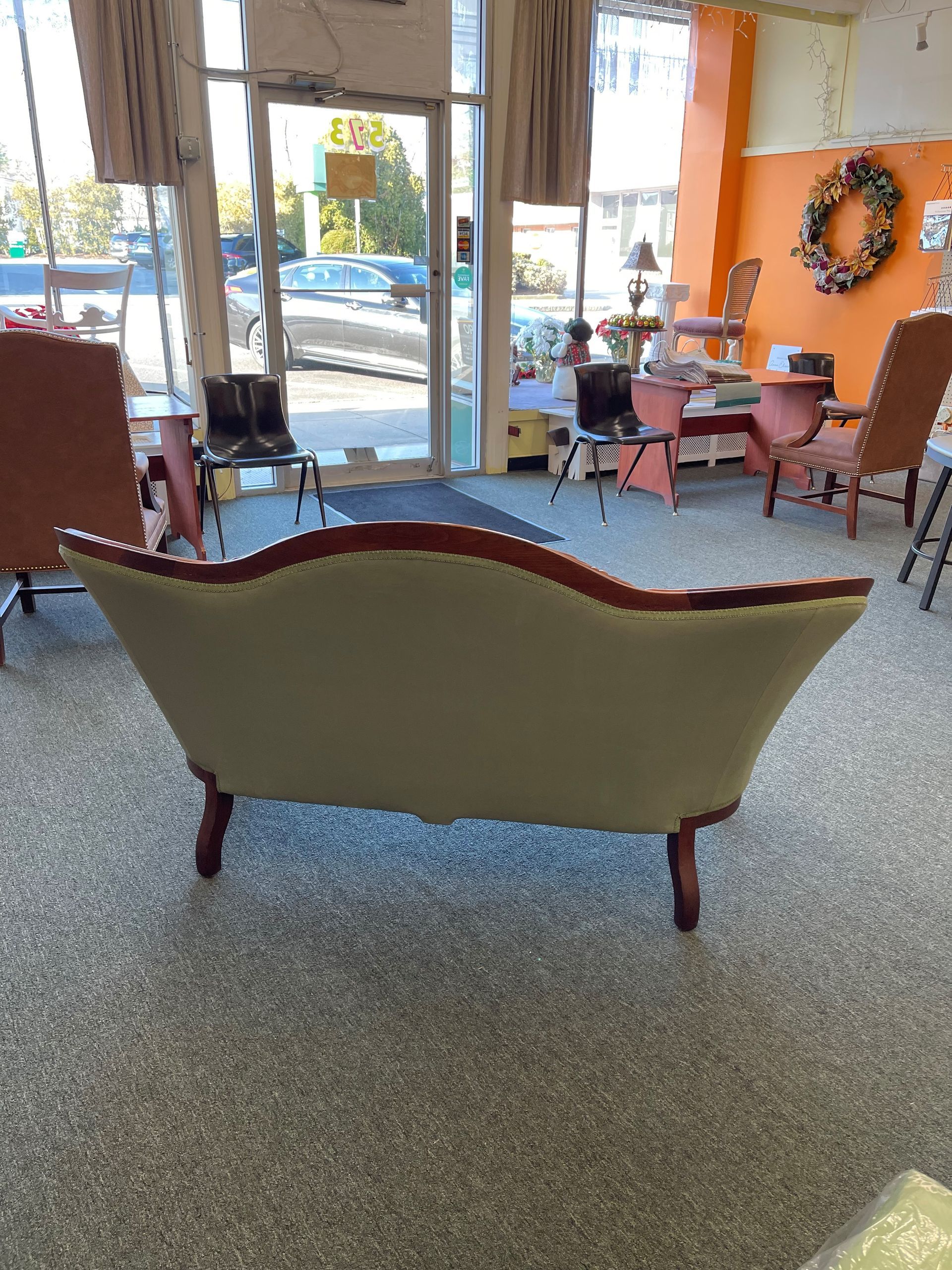 A living room with a couch and chairs in it