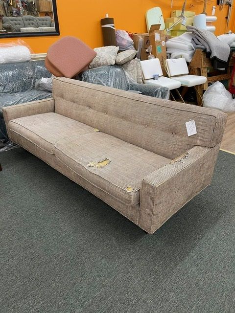 A couch with a tag on it that says ' couch ' on it