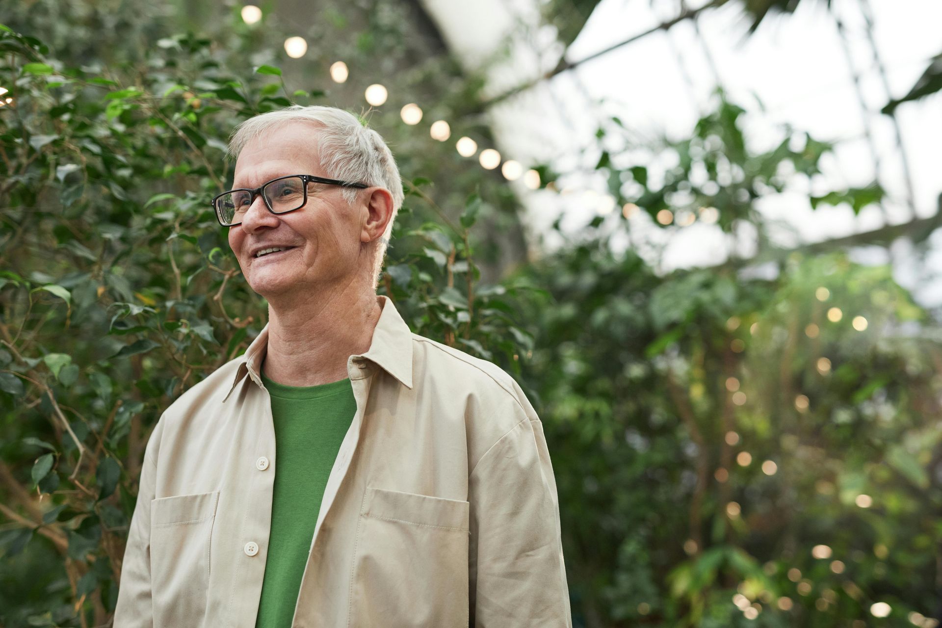 Retired middle-aged man in greenhouse