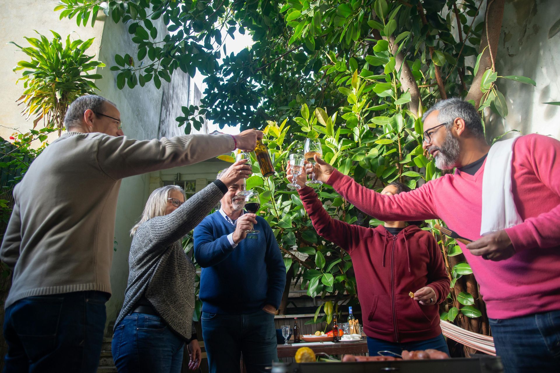 Group of retirees having a cheers with their drinks