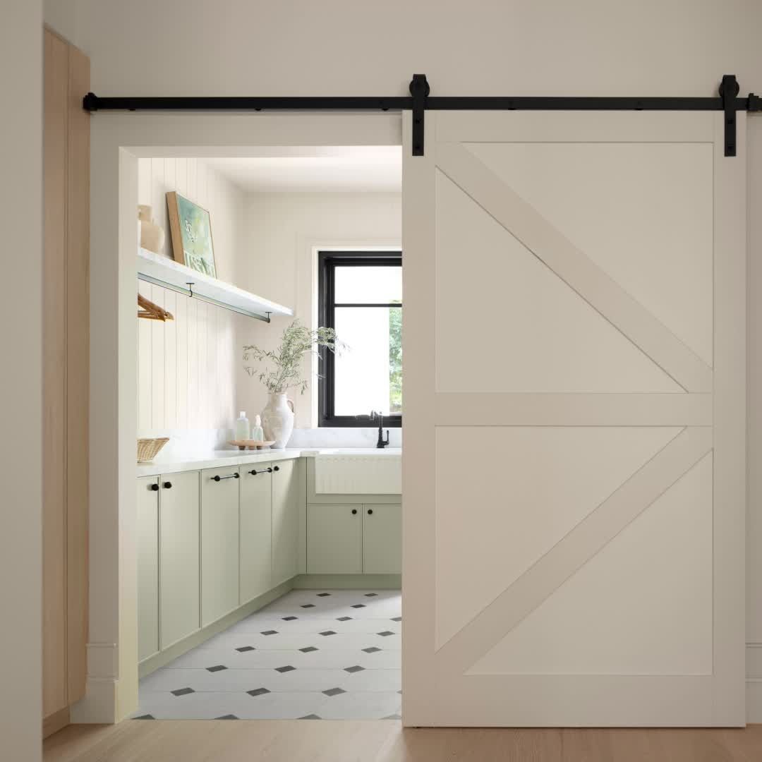 A Kitchen with A Sliding Barn Door and A Sink — Bootle Timber QLD Pty Ltd in Garbutt, QLD