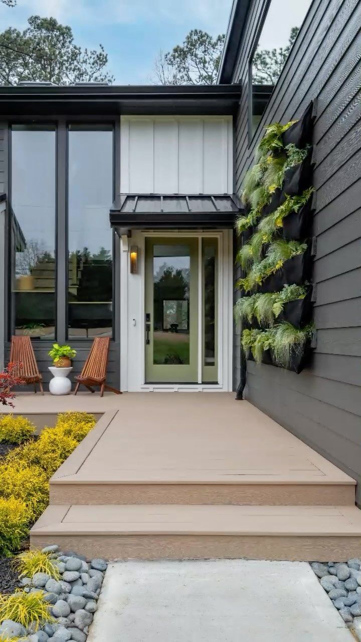 The Front of A House with A Green Door and A Walkway Leading to It — Bootle Timber QLD Pty Ltd in Garbutt, QLD
