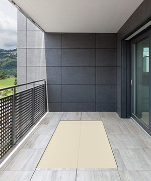 A Balcony with A Rug on The Floor and A Fence — Bootle Timber QLD Pty Ltd in Garbutt, QLD