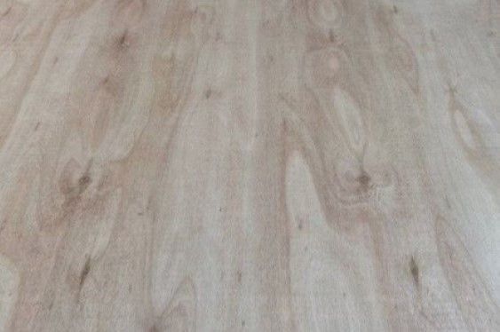 A close up of a wooden floor with a grainy texture.