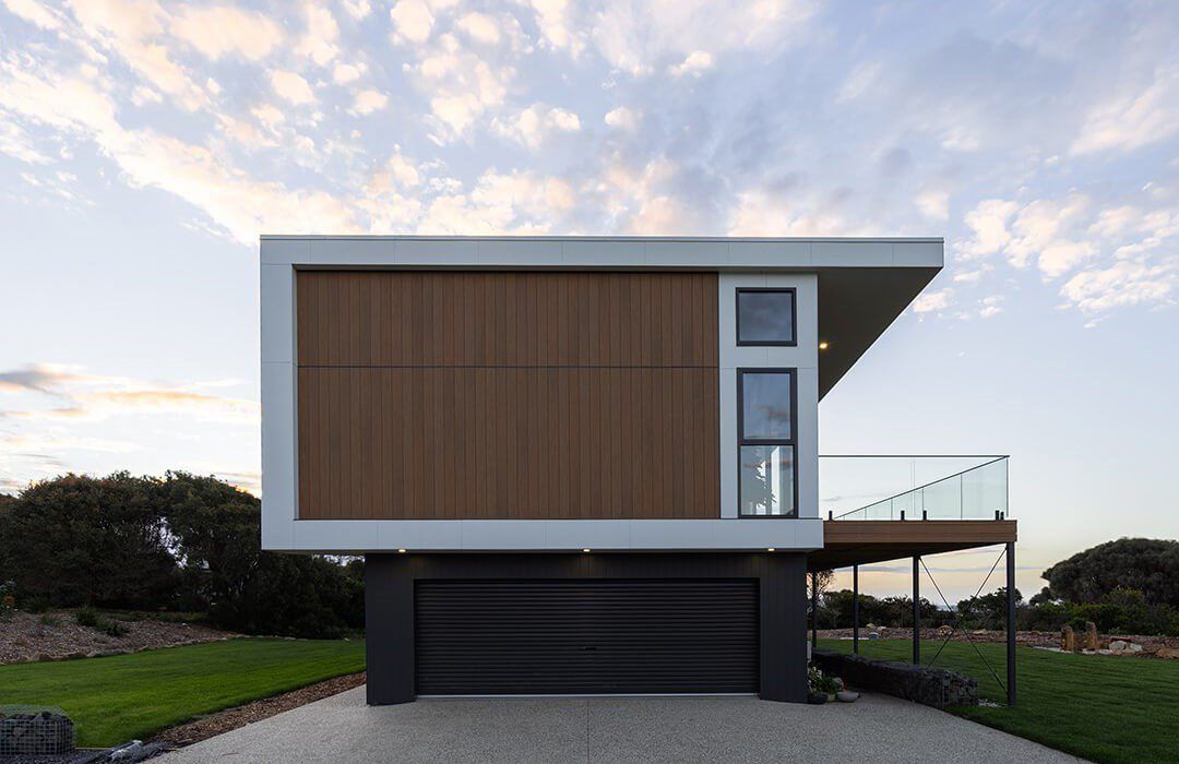 A Modern House with A Garage and A Balcony — Bootle Timber QLD Pty Ltd in Garbutt, QLD