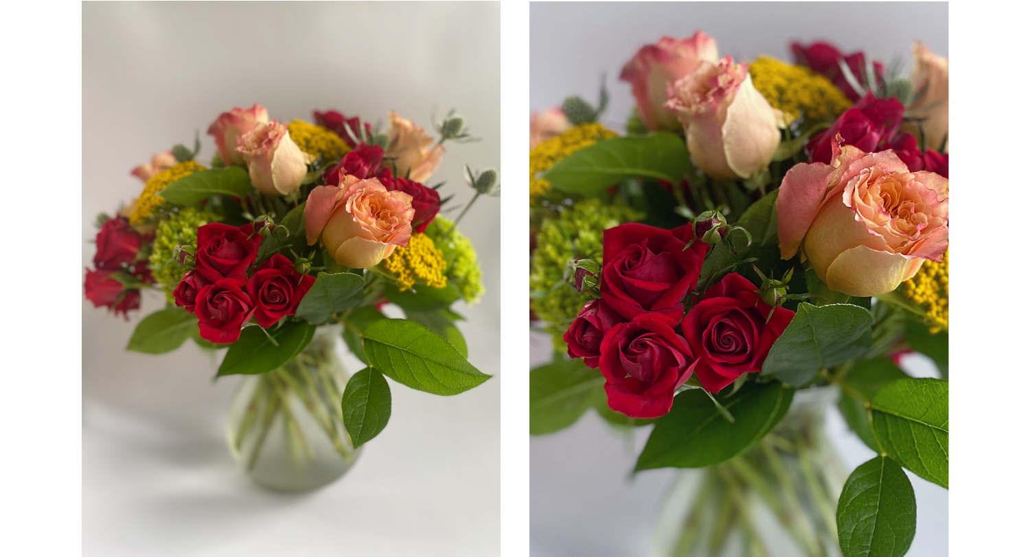 Mixed garden flowers in a vase on a white background.