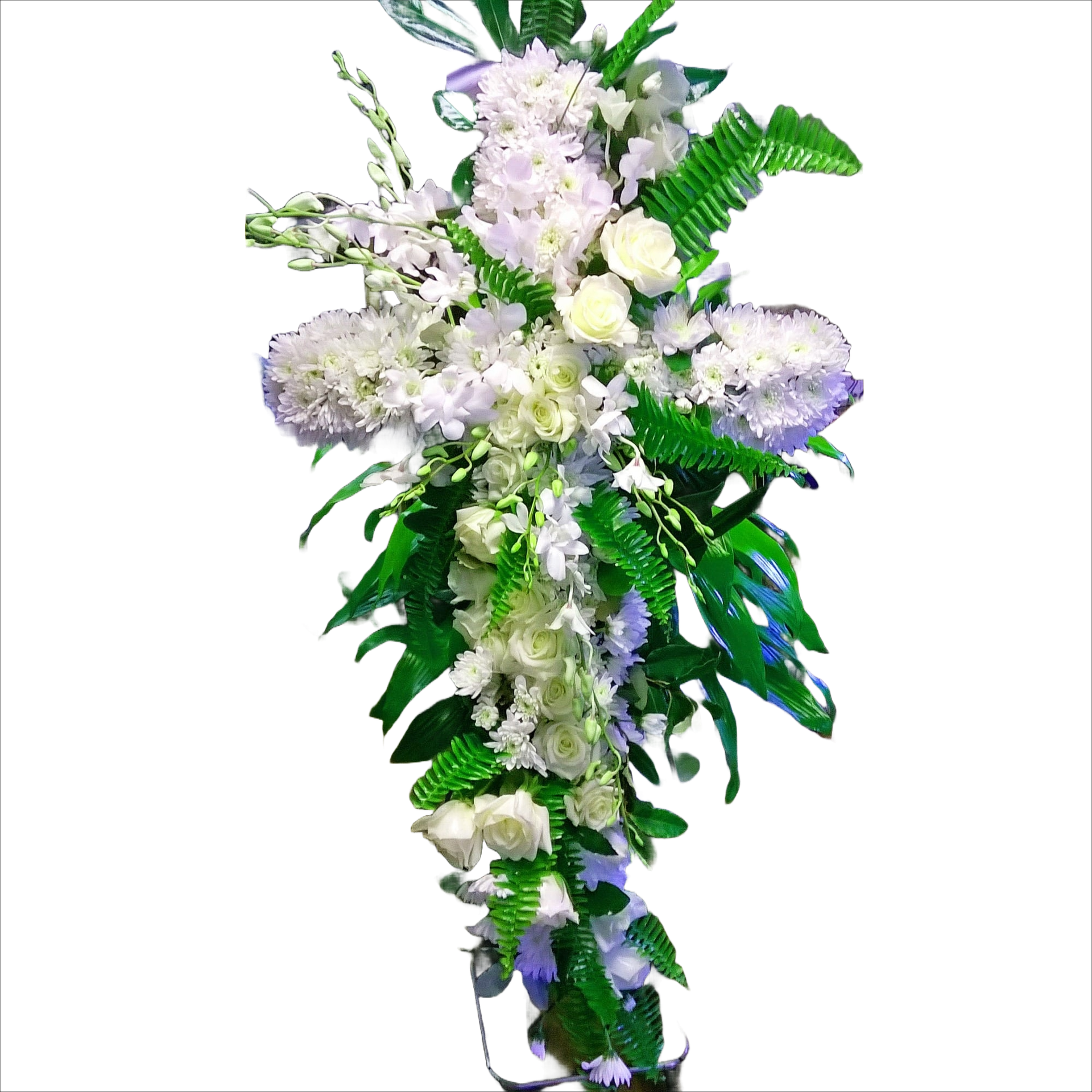 White floral cross arrangement with greenery.