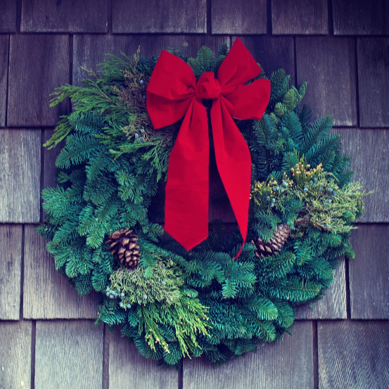 A Christmas wreath with a red bow - Elizabeth's Garden, Mobile AL