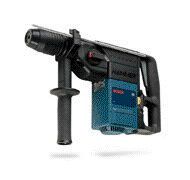 A person is using a drill to drill a hole in a piece of wood.