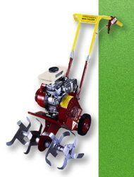 A person is riding a dirt bike on a dirt road.