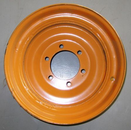 Two pieces of metal are sitting on a white surface.