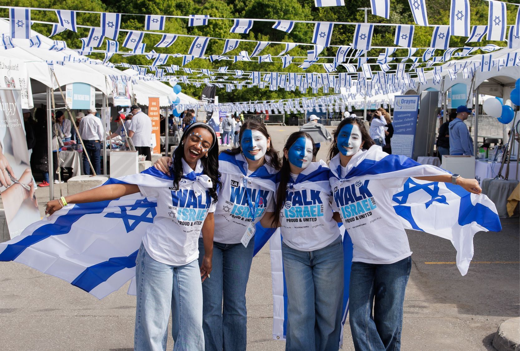Walk participants celebrating at the Shuk