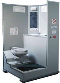 A toilet is sitting in the middle of a room.