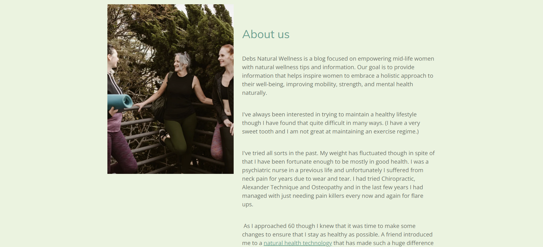 Three women on a deck by trees with 