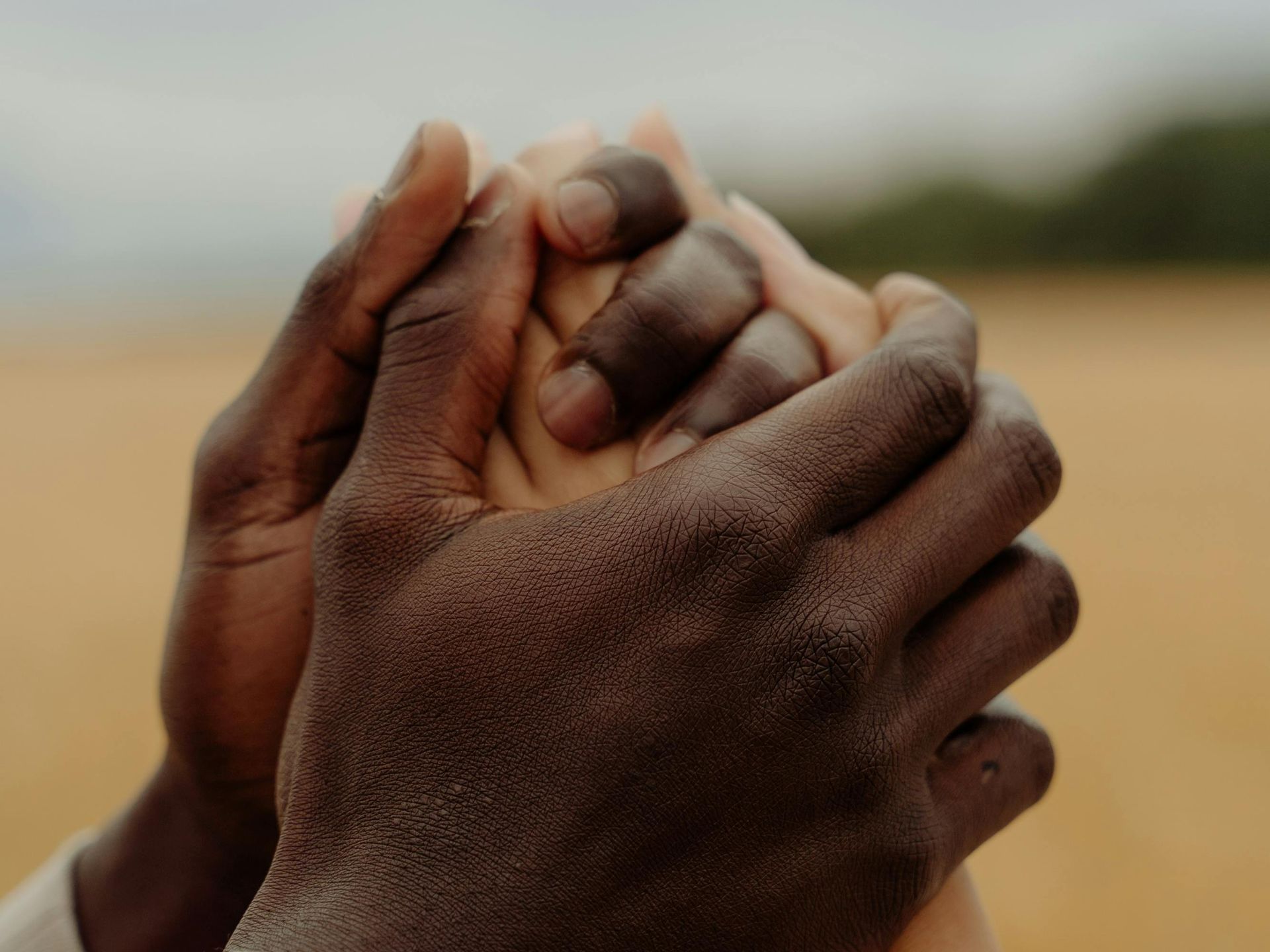 Hands holding each other representing love support and planning ahead for your family's future