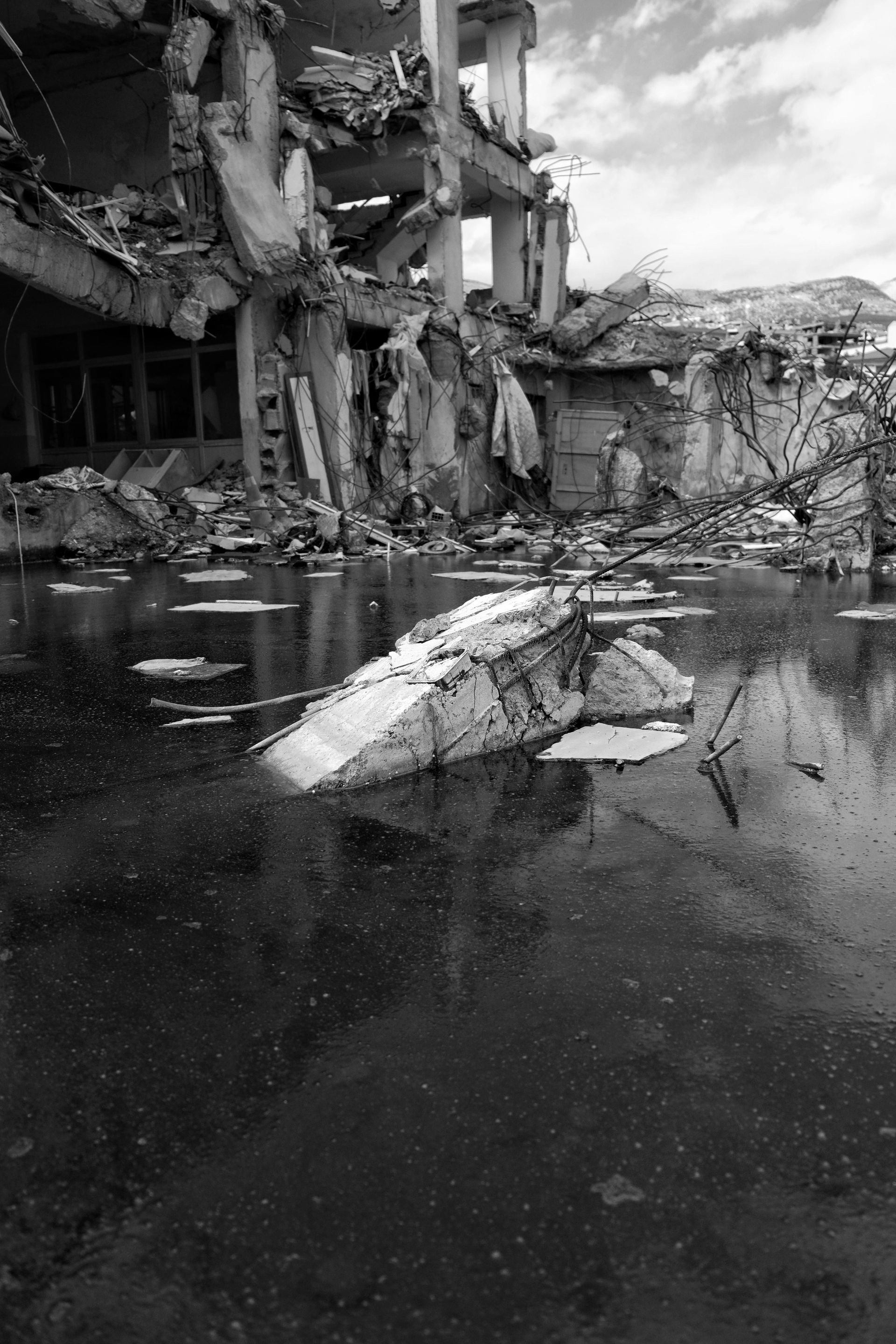 Damaged home from natural disaster in California showing the need for estate planning and emergency preparation
