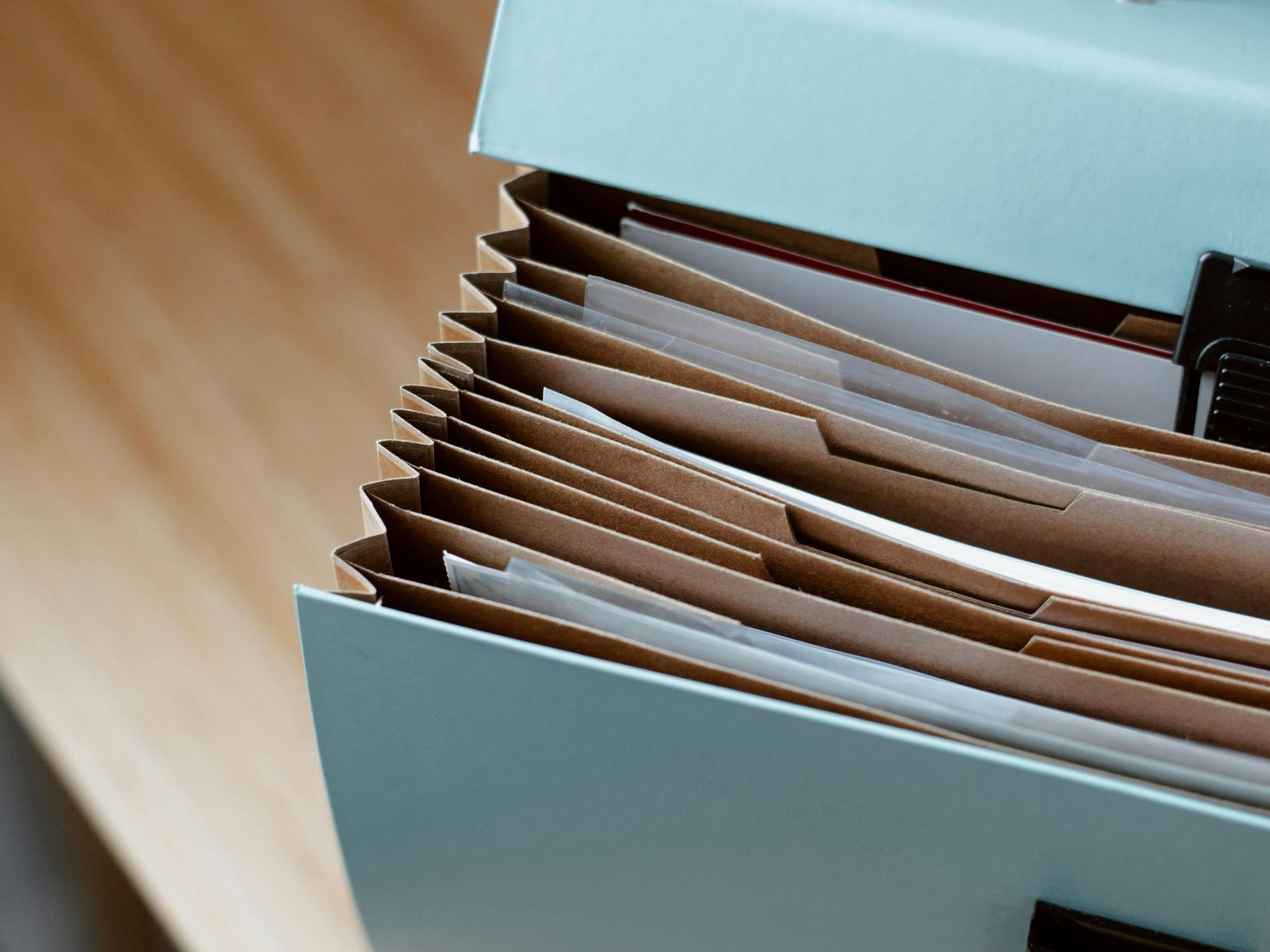 Folder containing estate plan trust documents and emergency records for disaster readiness