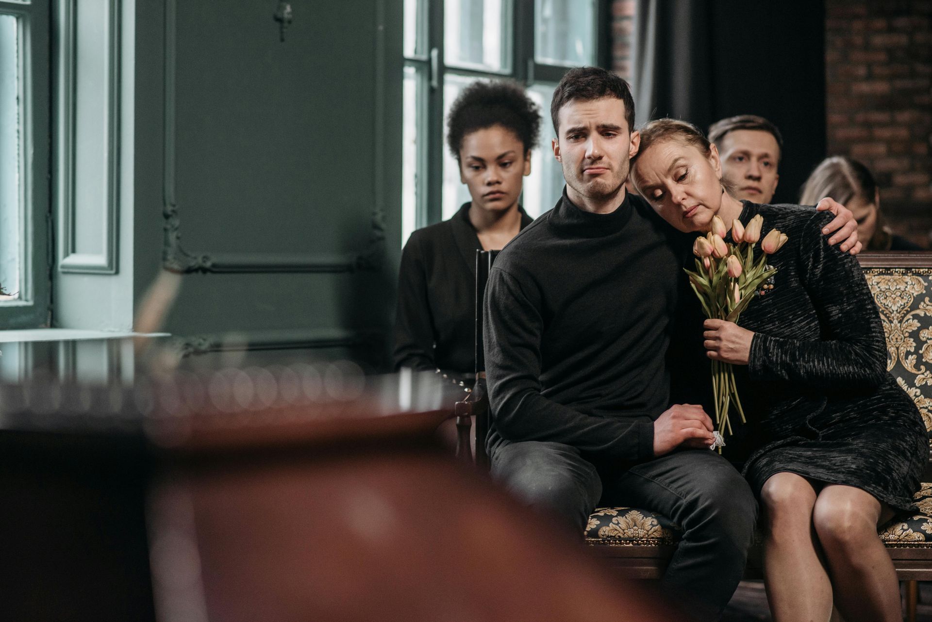 Family at a funeral dealing with legal and probate responsibilities after a loved one’s passing in California