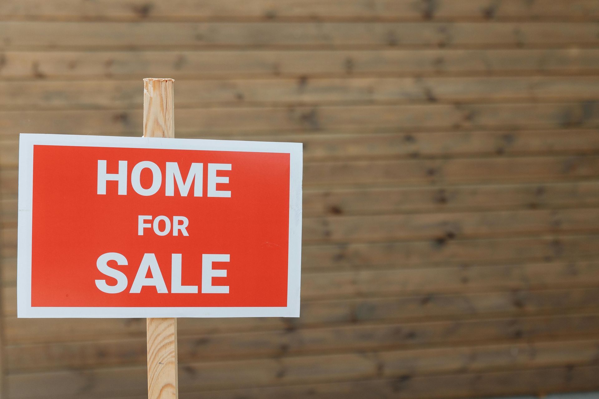 For sale sign in front of home representing selling a house during probate in California