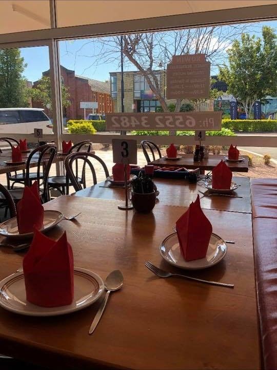 A Restaurant With Tables and Chairs and Plates and Napkins on Them — Kowin Restaurant in Forster, NSW