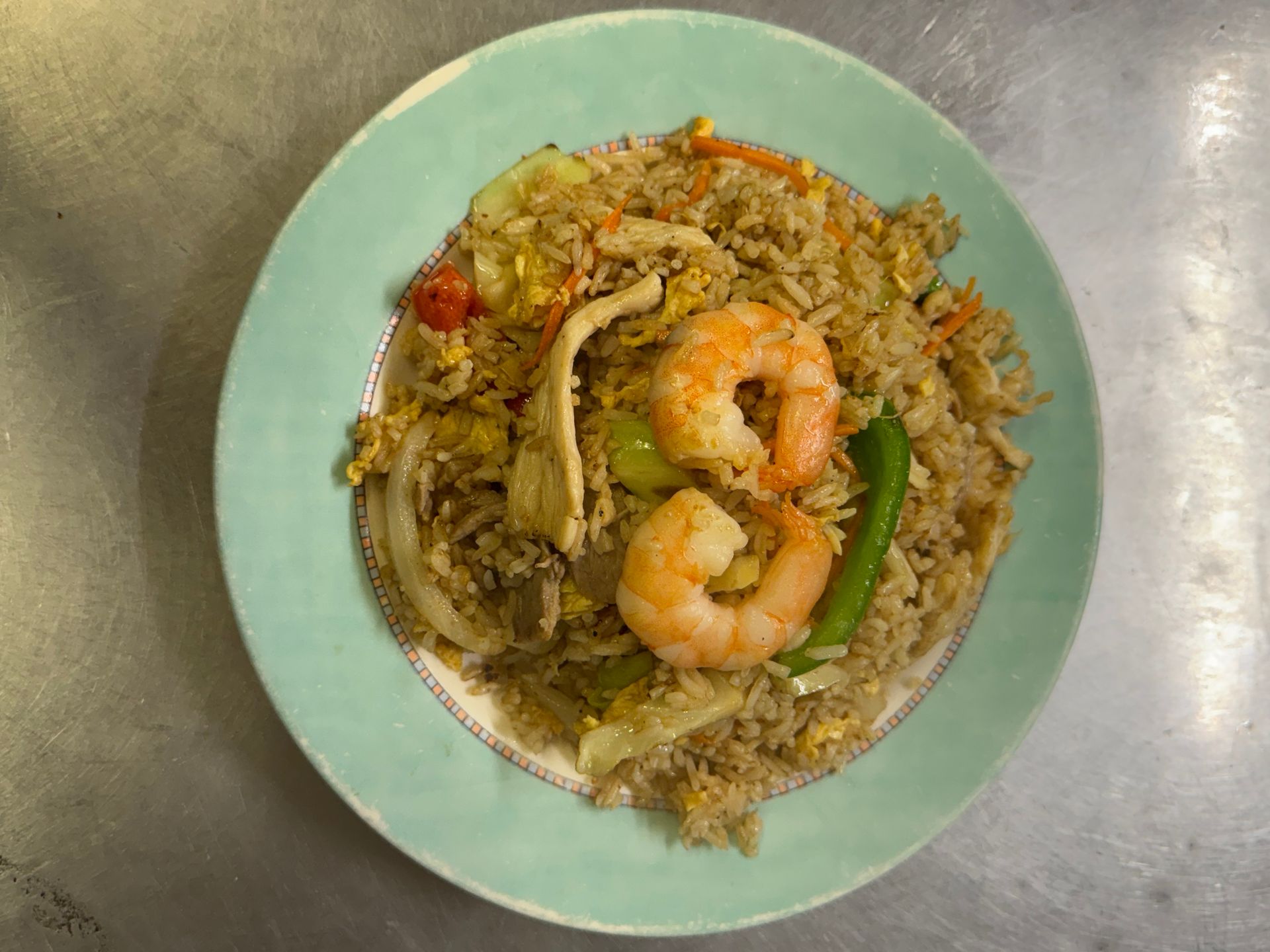 Fried rice with shrimp on a light green plate. — Kowin Restaurant in Forster, NSW
