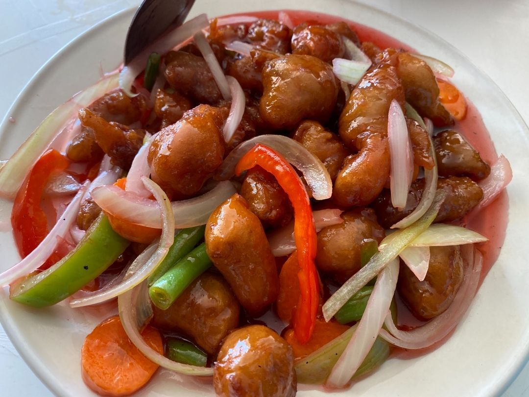 A Close Up of a Plate of Food With Meat and Vegetables on a Table — Kowin Restaurant in Taree, NSW