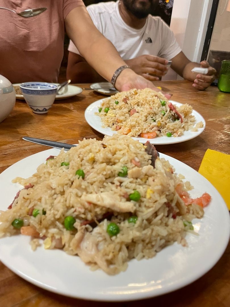 Two Plates of Fried Rice Are on a Wooden Table — Kowin Restaurant in Forster, NSW