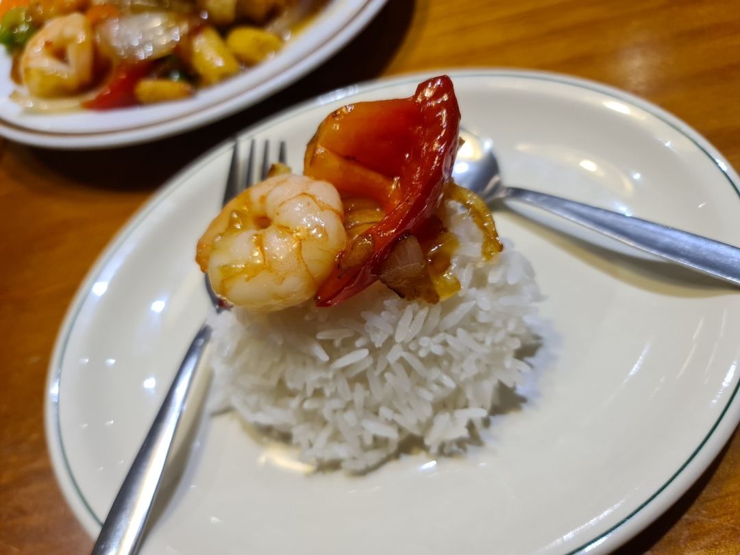 A Plate of Shrimp and Rice With a Fork and Spoon — Kowin Restaurant in Old Bar, NSW