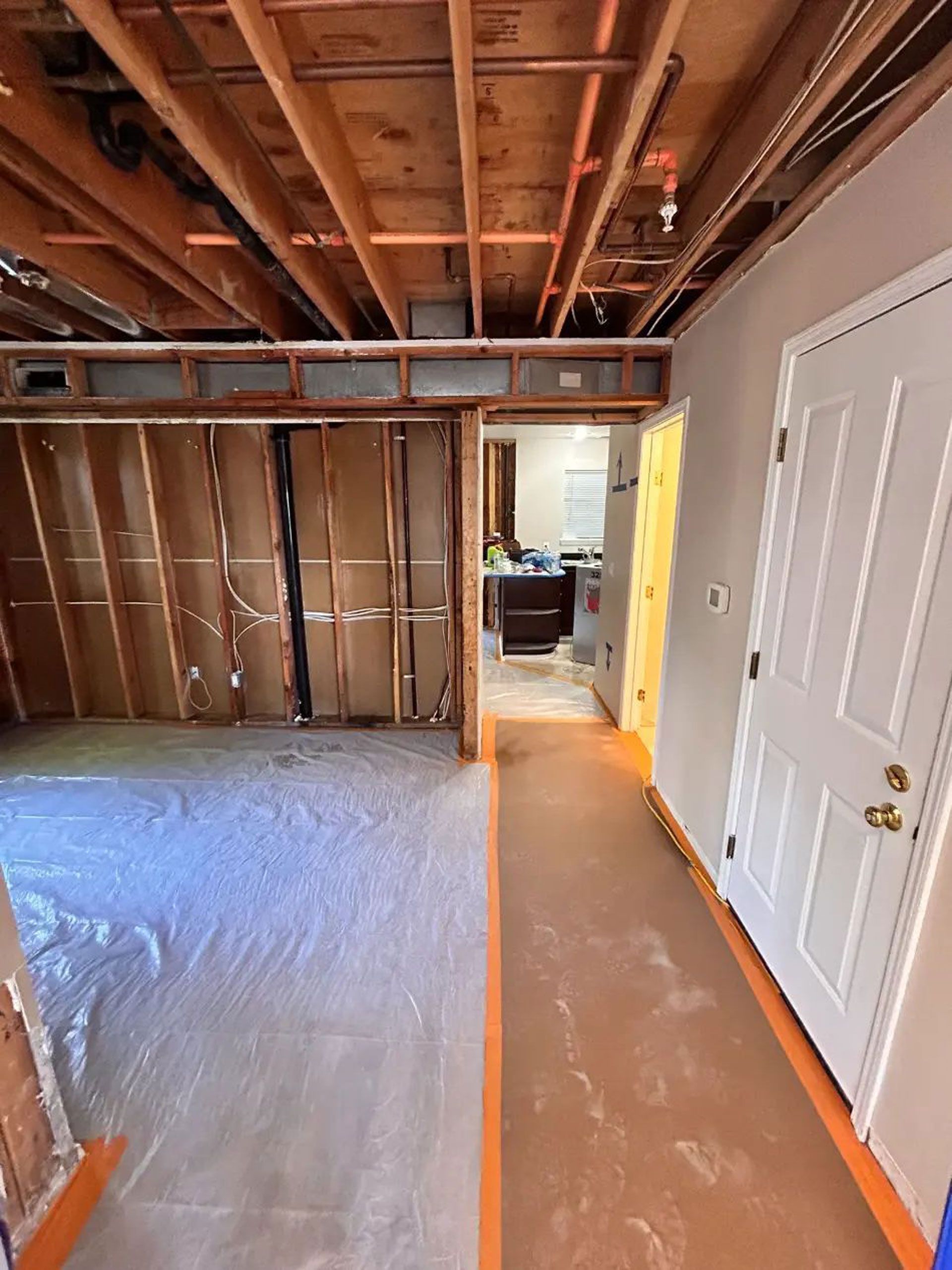 A hallway in a house that is being remodeled