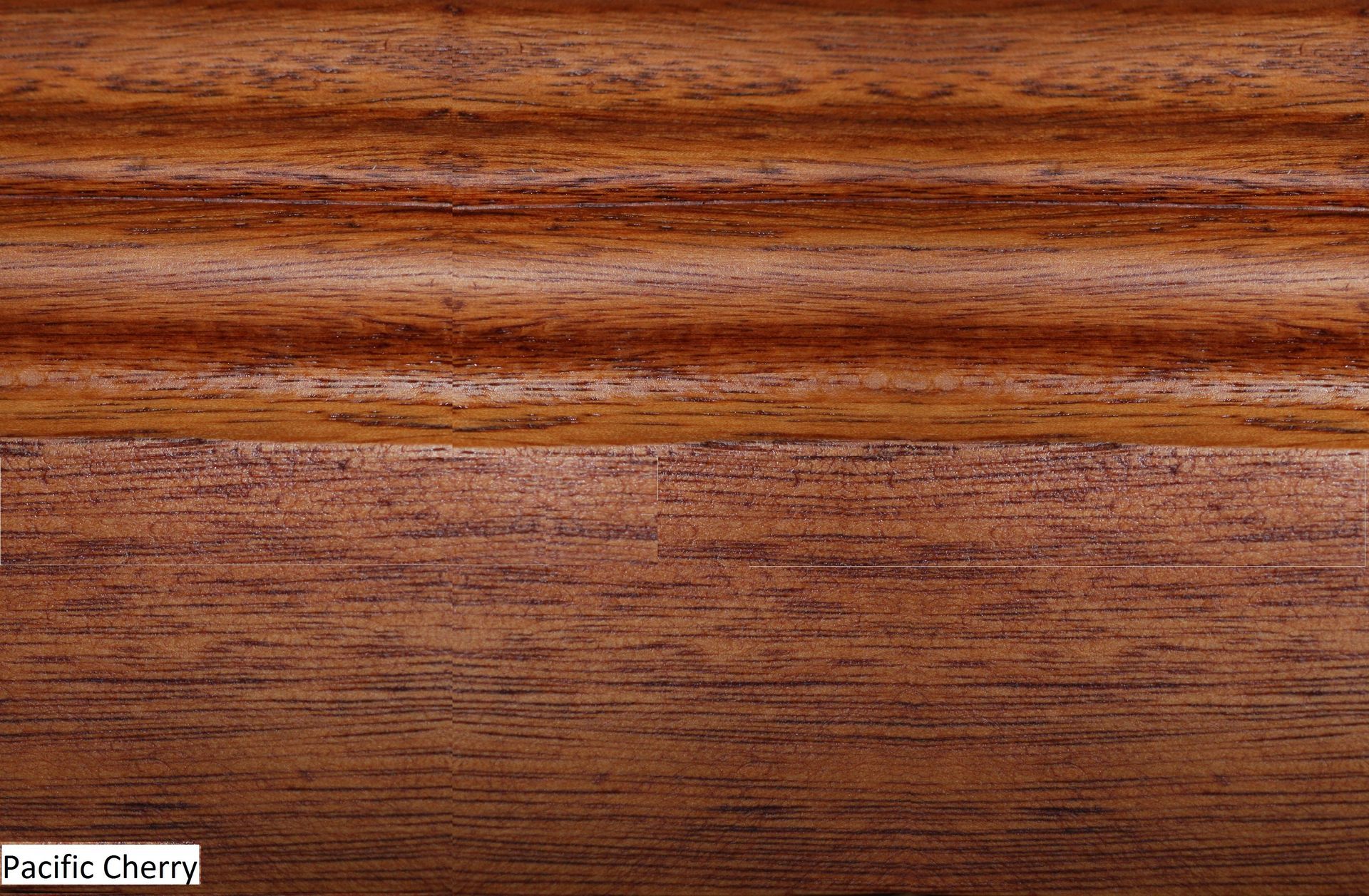 A close up of a piece of wood with the word pacific cherry on it.