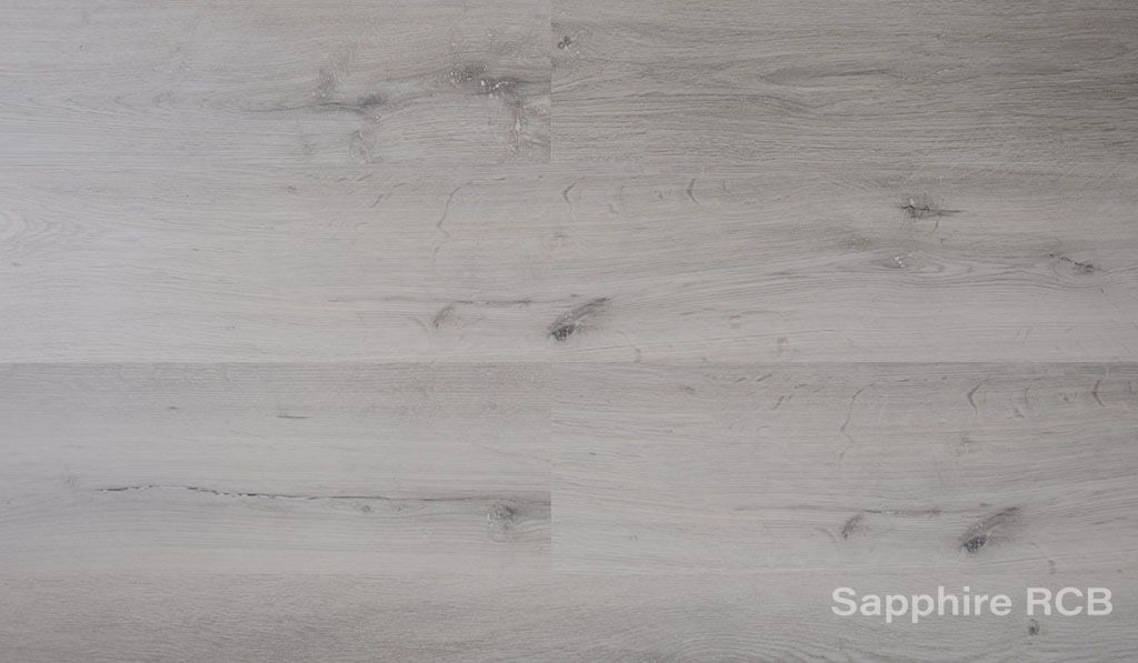 A close up of a white wooden floor with the words `` sapphire rcb '' written on it.
