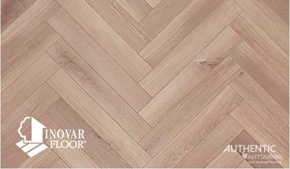 A picture of a herringbone wood floor from inovar floor