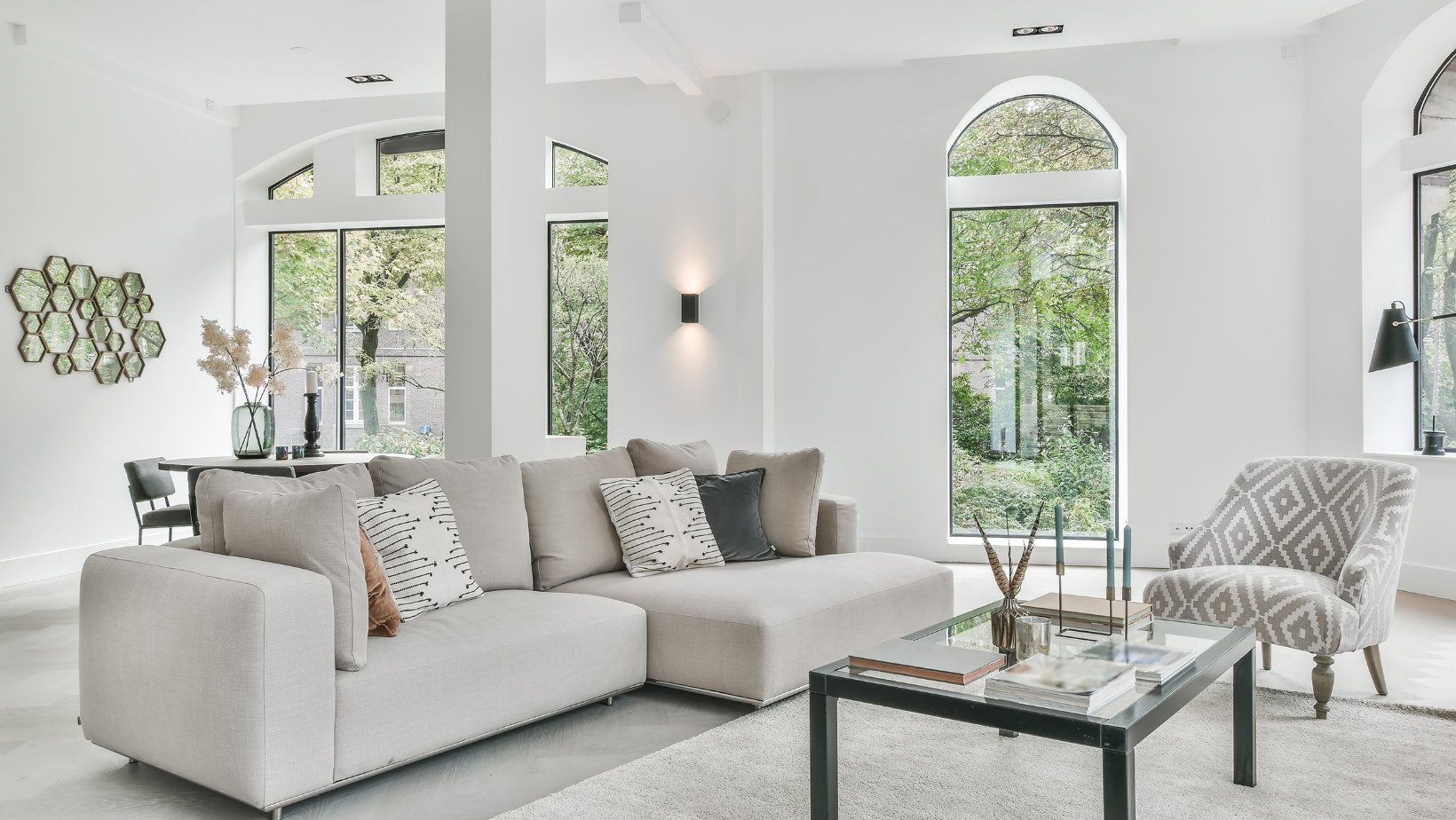 A modern living room with white and gray theme.