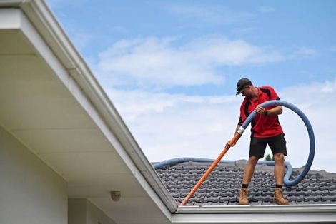 Man Cleaning Roof Gutter – Highland, IL – We Wash Dirty Houses