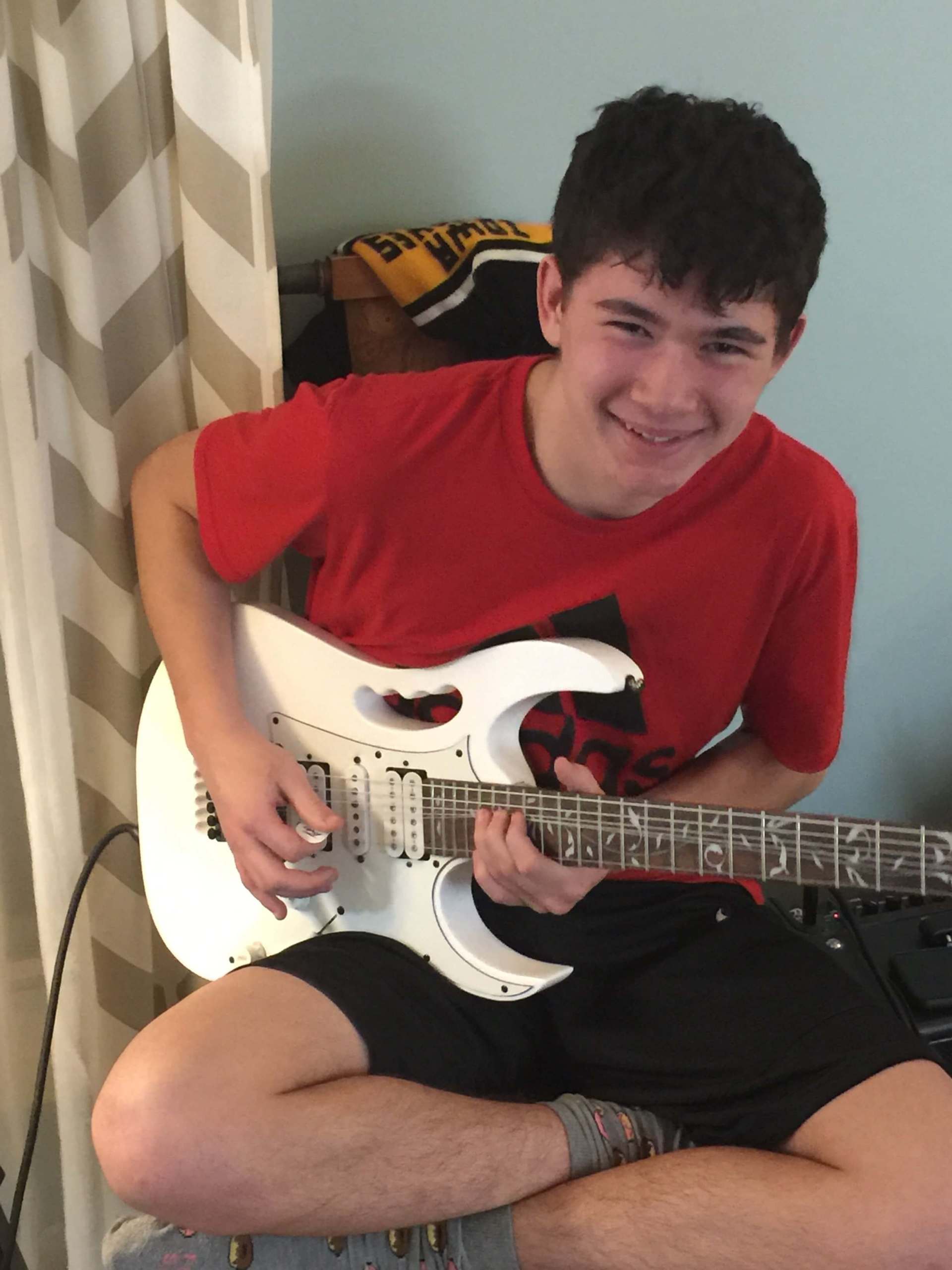 Kid in Red Shirt Playing Bass — A Plus In Home Guitar Lessons — Arlighton Heights, IL