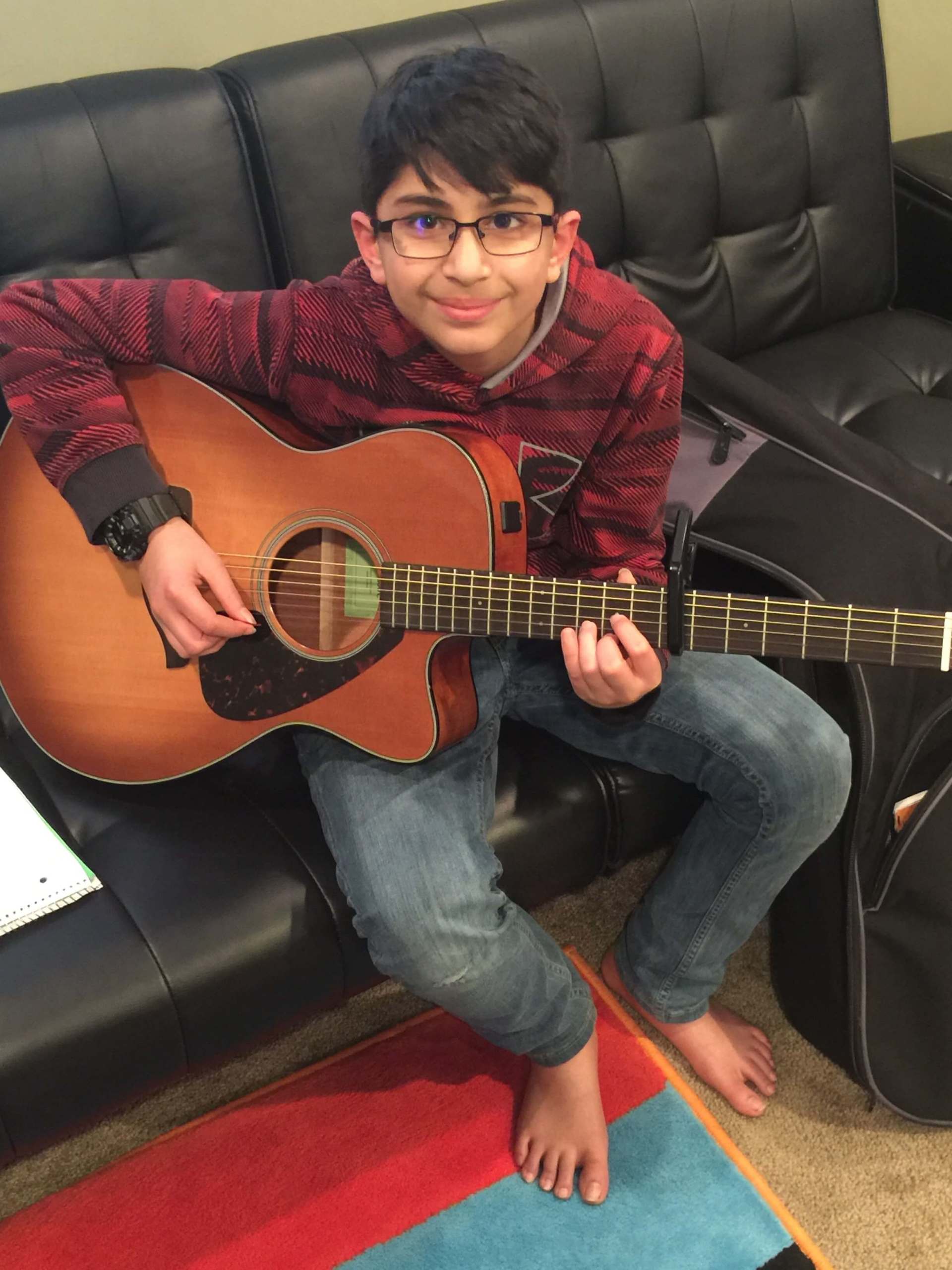 Kid with Glasses Playing  Acoustic Guitar — A Plus In Home Guitar Lessons — Arlighton Heights, IL
