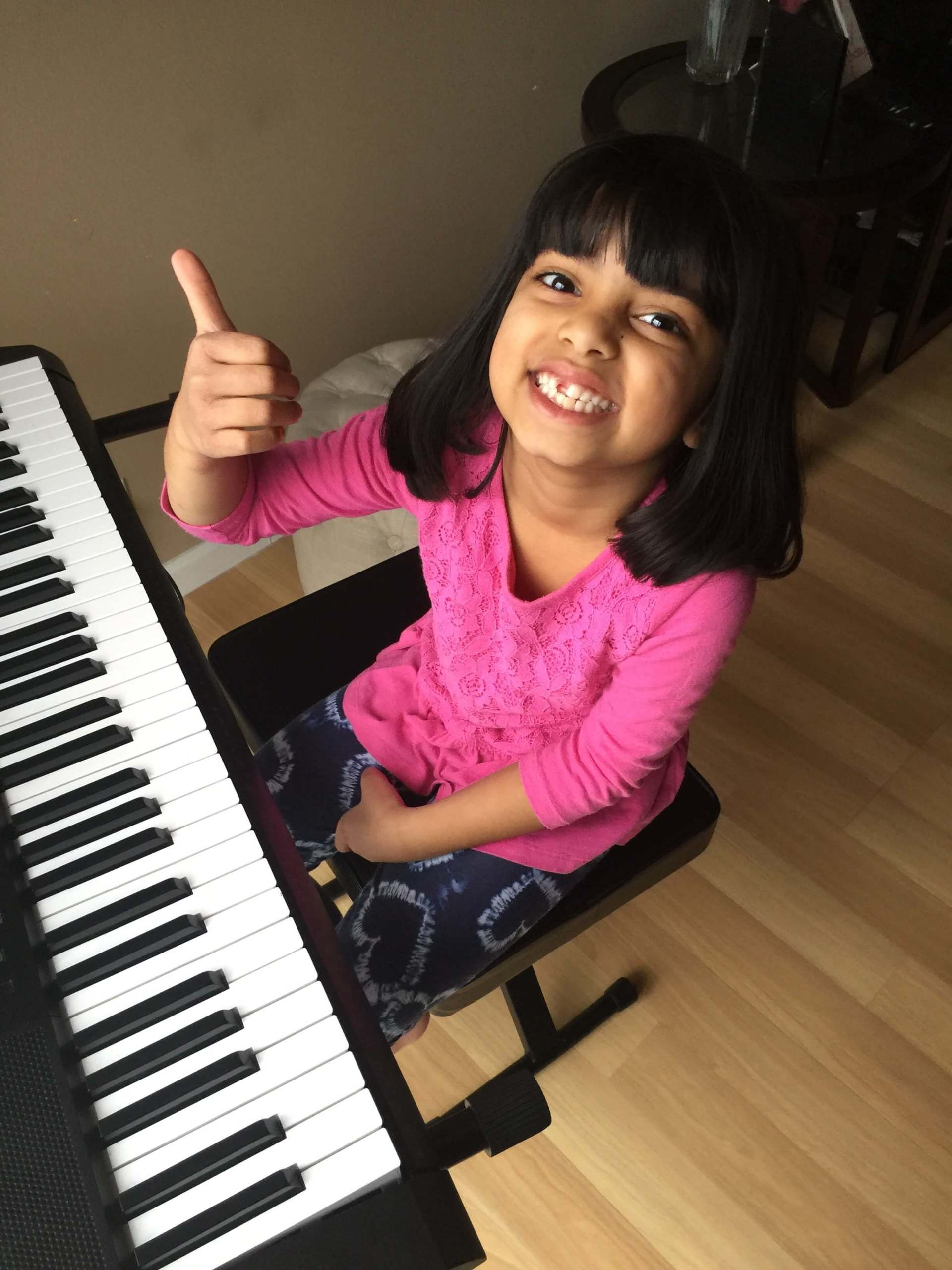 Girl on Pink Dress Playing Piano — A Plus In Home Guitar Lessons — Arlighton Heights, IL