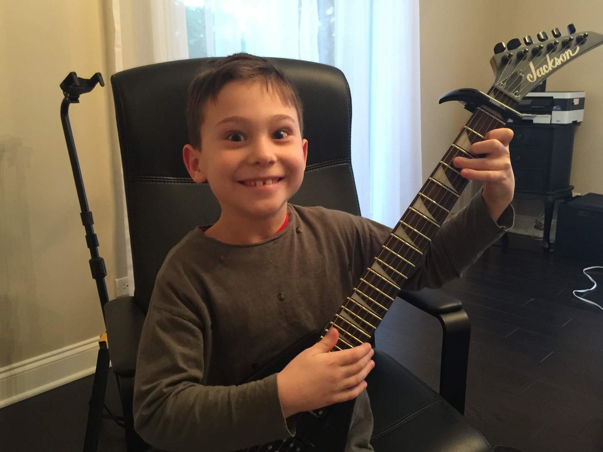 Kid Playing Guitar — A Plus In Home Guitar Lessons — Arlighton Heights, IL