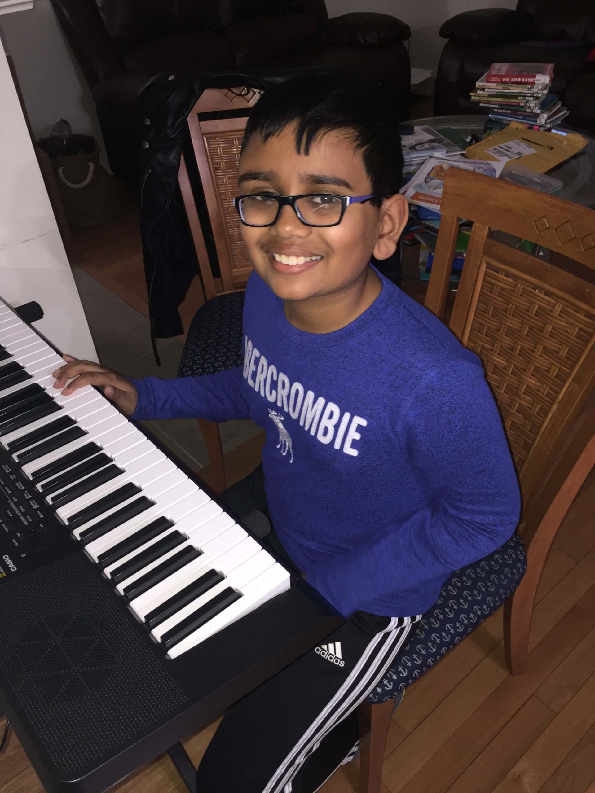 Boy in Violet Long Sleeve Playing Piano — A Plus In Home Guitar Lessons — Arlighton Heights, IL