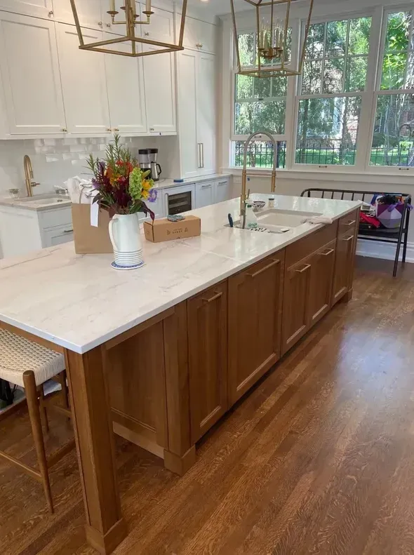 There is a large island in the middle of the kitchen.