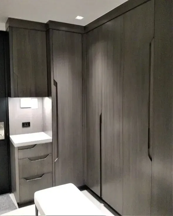 A room with a lot of cabinets and drawers