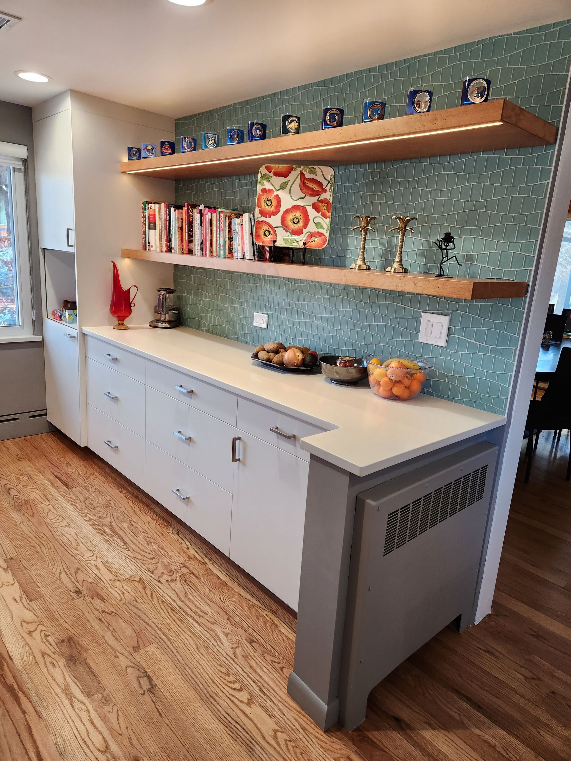 A wooden table with a basket of bananas and wooden utensils on it.