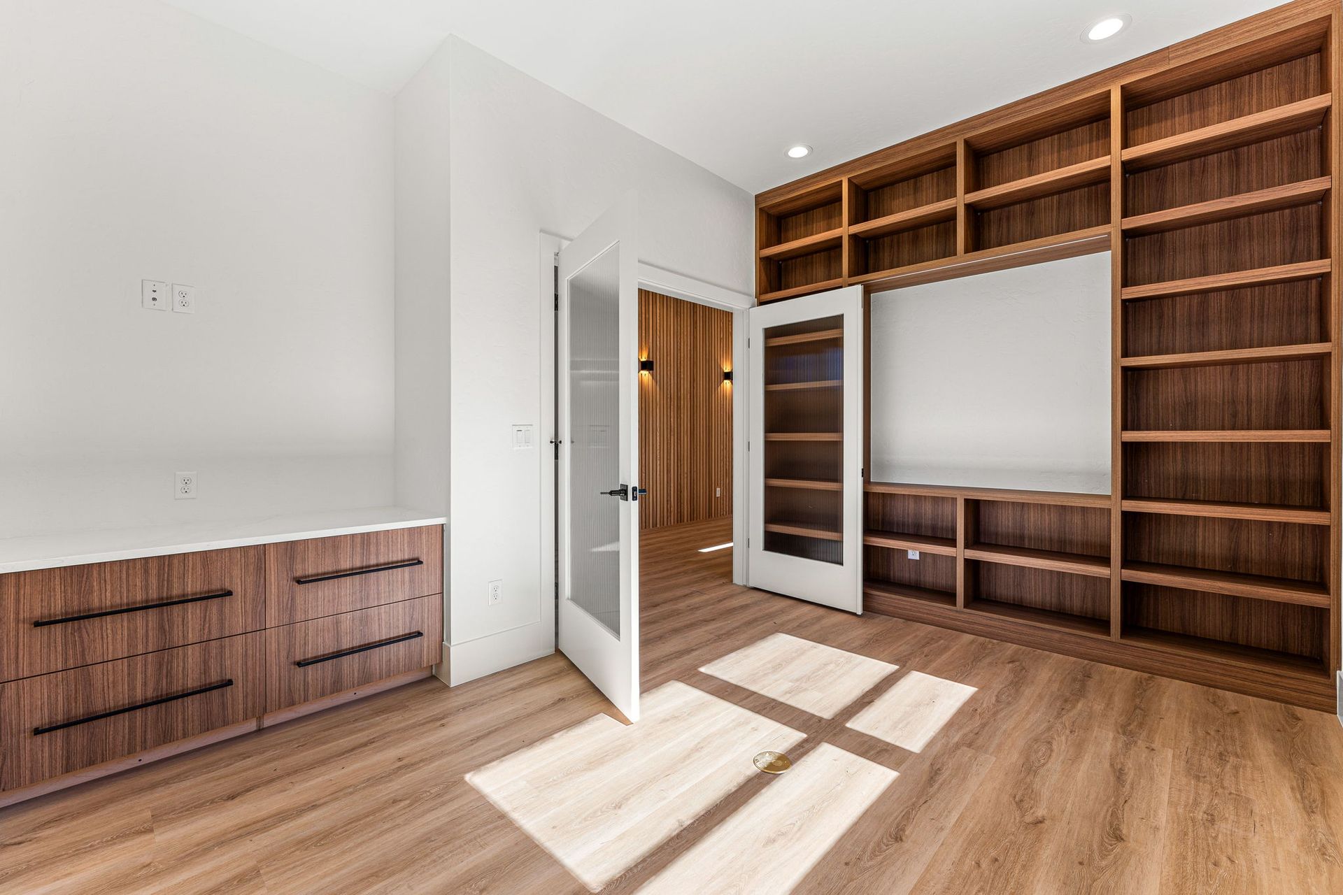 A family is having fun in the kitchen while preparing food.