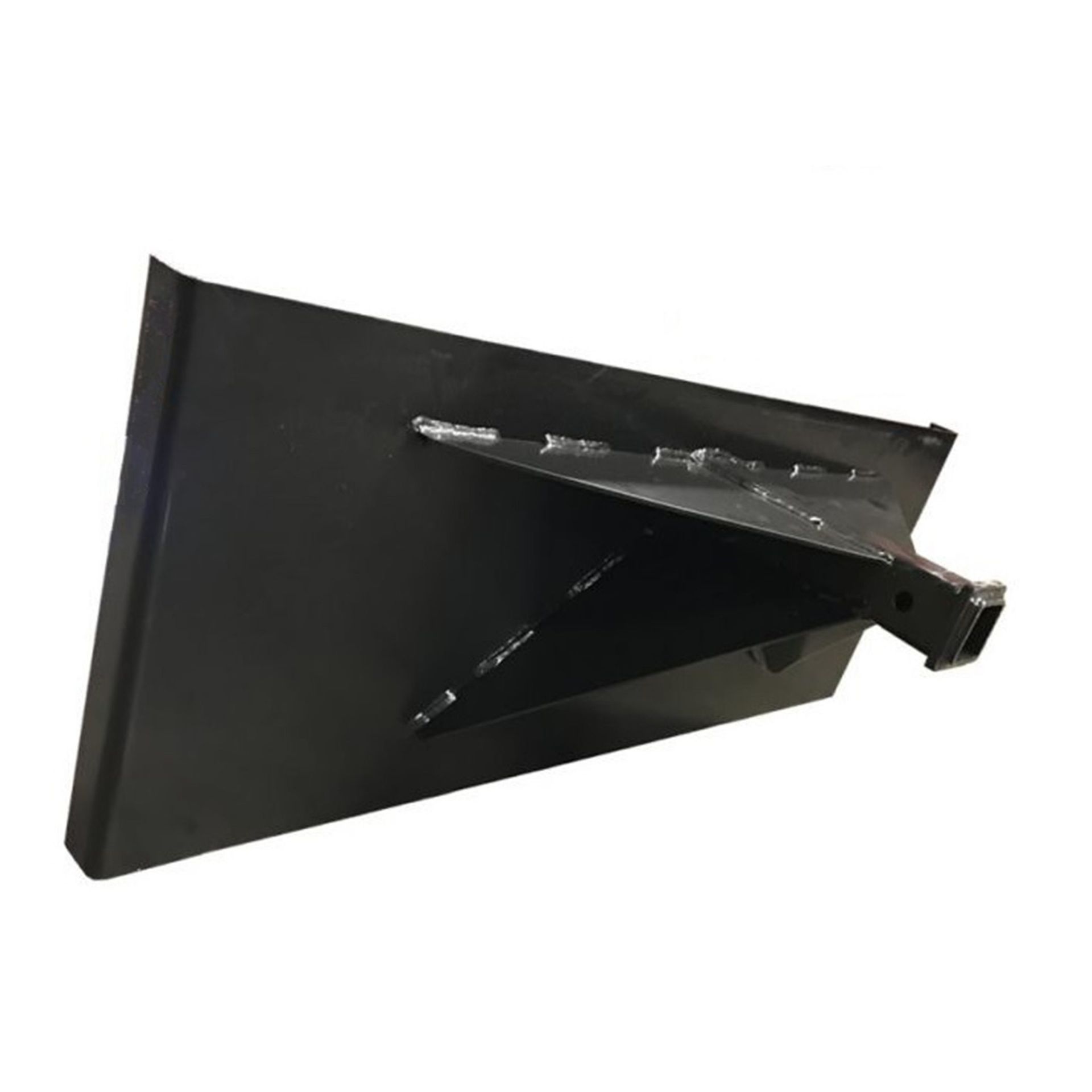 A black metal object is sitting on a white surface.