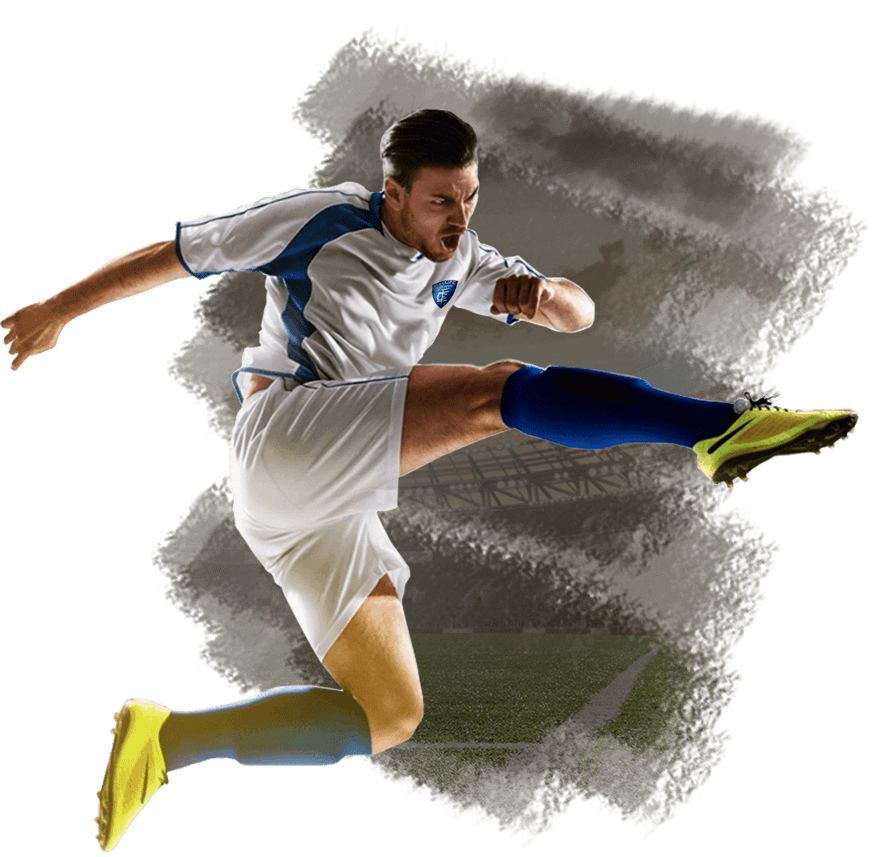 A soccer player is kicking a ball in the air