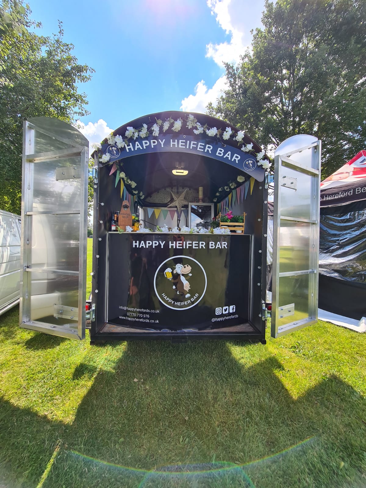 Happy heifer horsebox bar at a festival