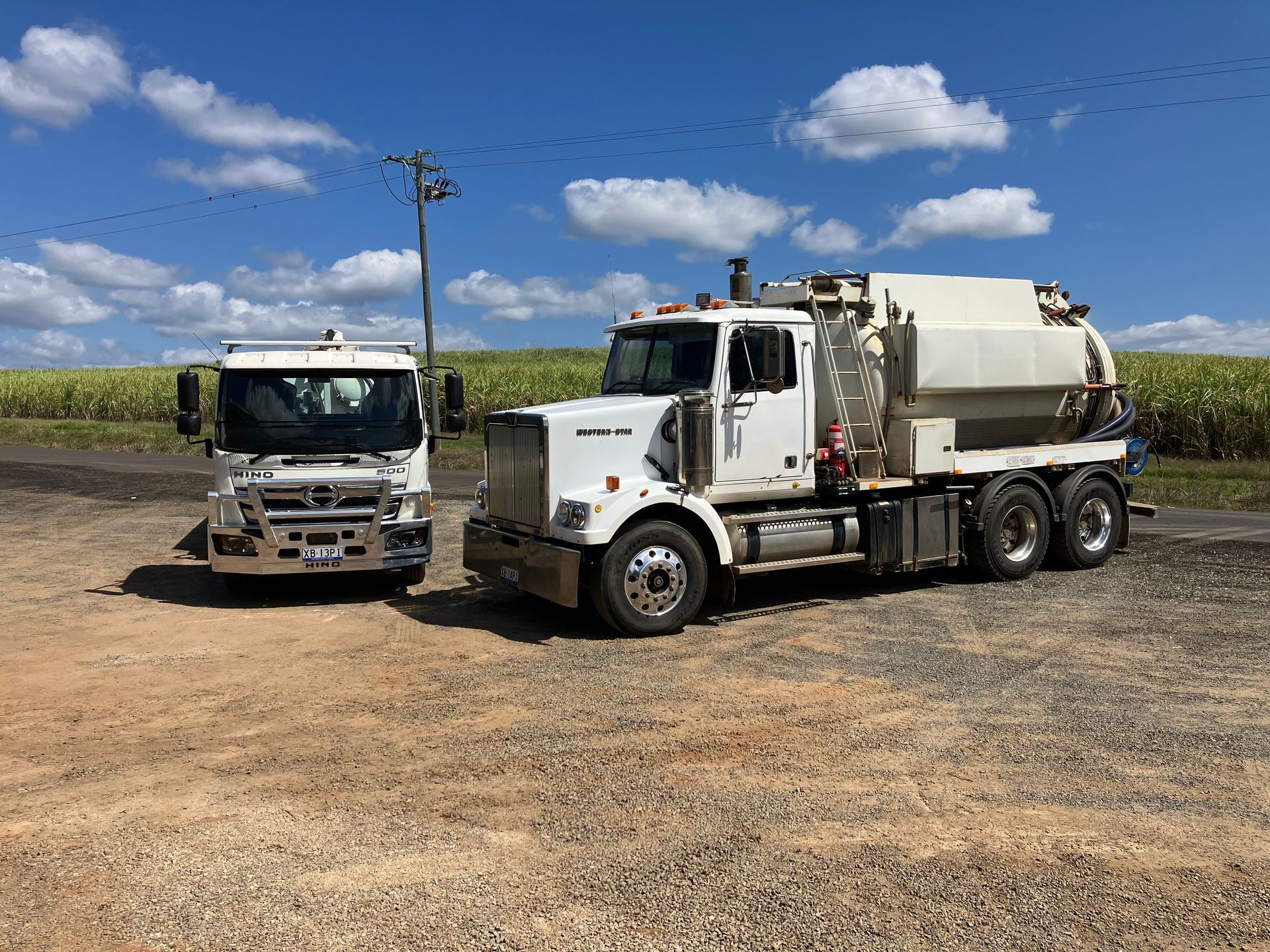A vacuum truck is pumping water into a septic tank.