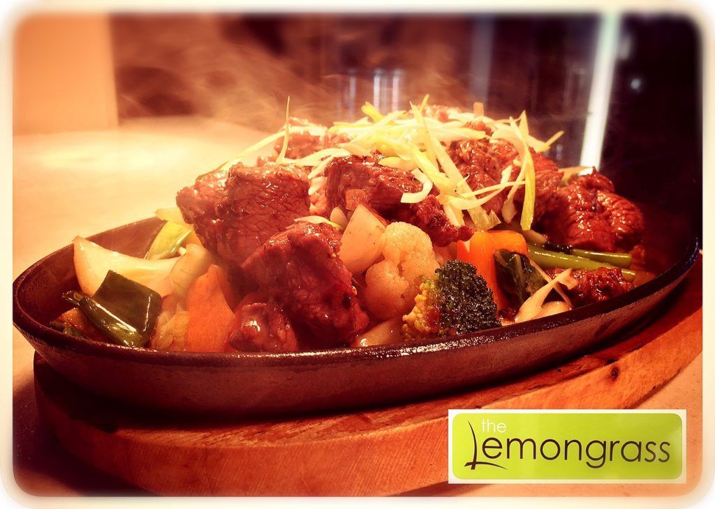 A plate of food with a lemongrass logo on it